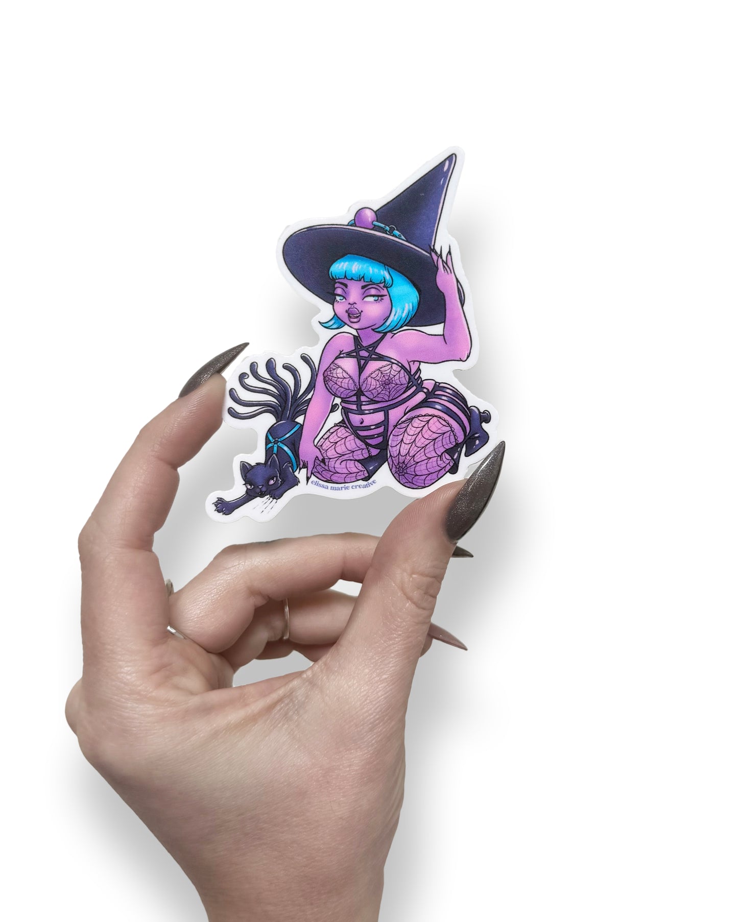 A die-cut vinyl sticker featuring a purple humanoid character known as "Bondage Witch," being held by a hand with witchy nails, in front of a white background.
