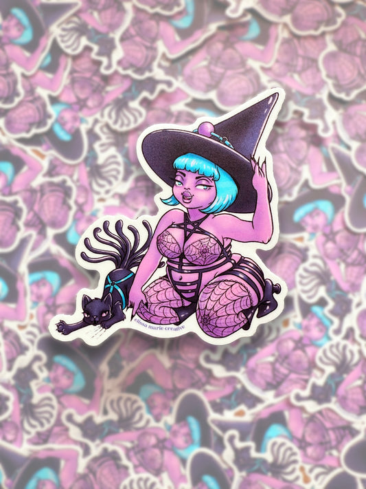 This image features a die-cut sticker depicting a whimsical character known as the "Bondage Witch." The sticker is approximately 3"x3", crafted from heavy-duty vinyl and uses UV-stable inks with a matte laminated finish for durability.